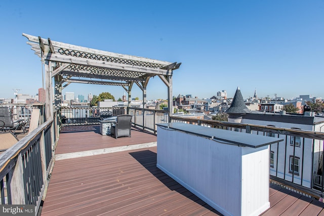 wooden deck featuring a pergola