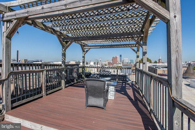 wooden deck featuring a pergola