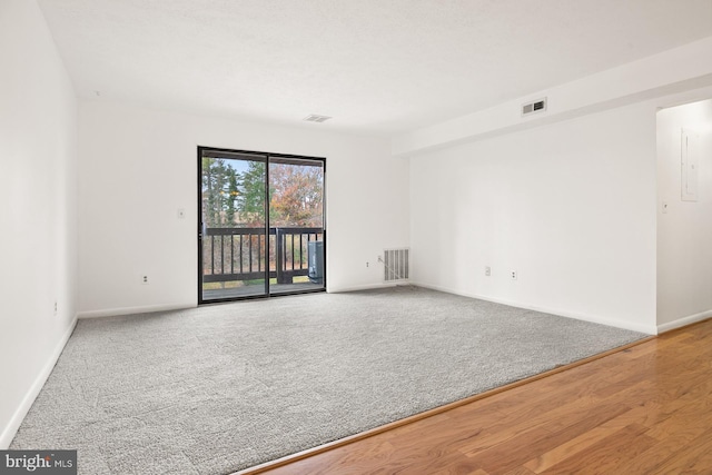 empty room featuring wood-type flooring