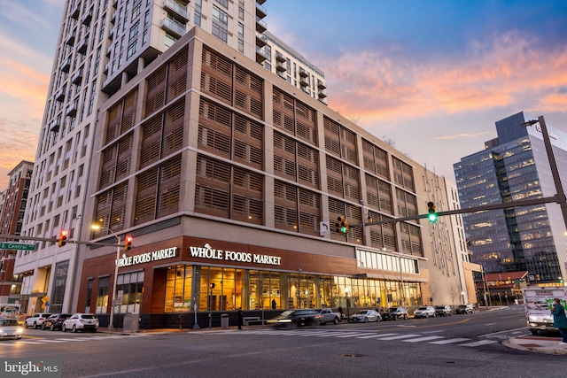 view of outdoor building at dusk