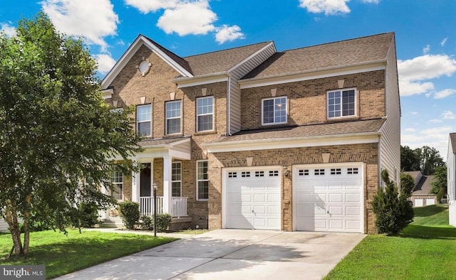 view of front of house featuring a front yard and a garage