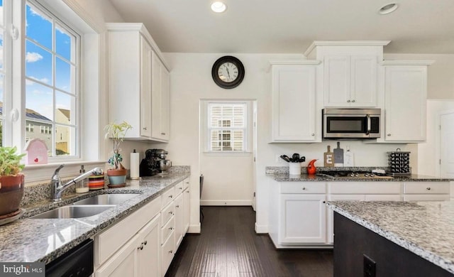 kitchen featuring sink, appliances with stainless steel finishes, and plenty of natural light