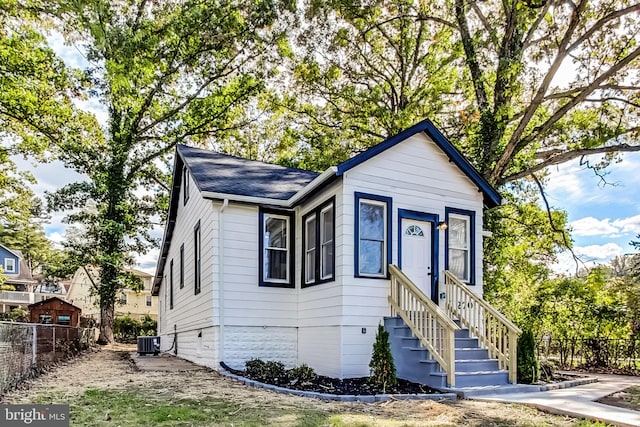 view of front of house featuring cooling unit