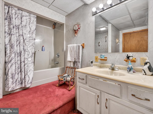 bathroom featuring vanity, shower / tub combo, and a paneled ceiling