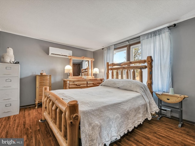 bedroom featuring a textured ceiling, a wall mounted air conditioner, and dark hardwood / wood-style flooring