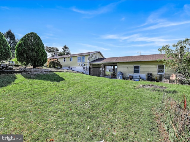 back of house with a yard