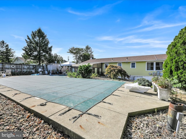 view of swimming pool featuring a patio area