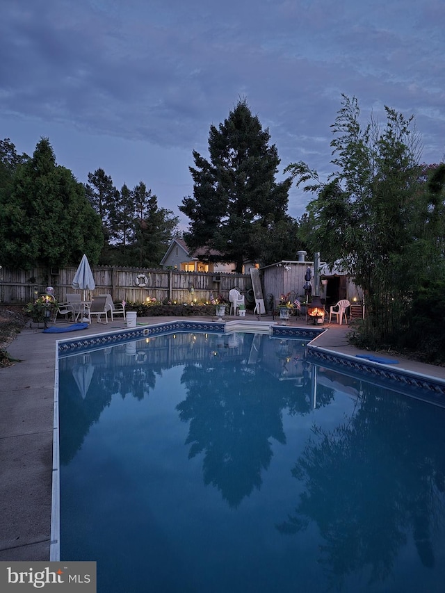 view of swimming pool featuring a patio