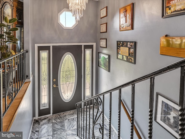 entryway featuring an inviting chandelier