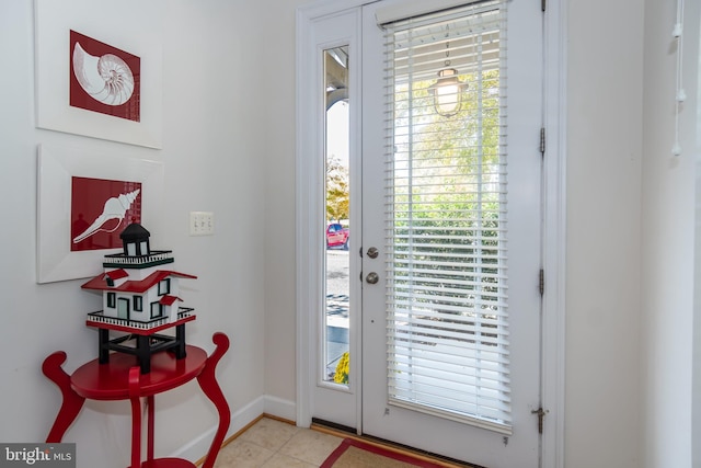 doorway to outside featuring light tile patterned floors