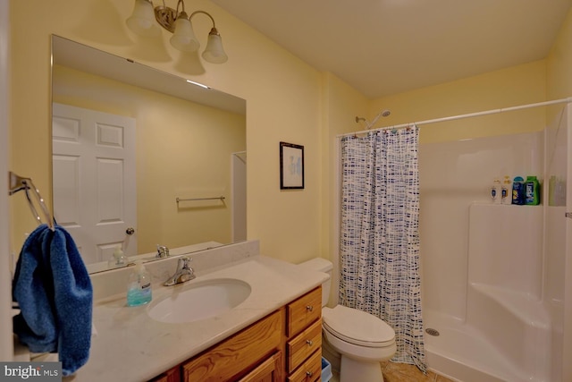 bathroom featuring vanity, toilet, and a shower with curtain