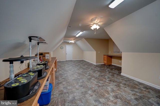 bonus room with ceiling fan and vaulted ceiling