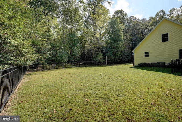 view of yard featuring central AC unit