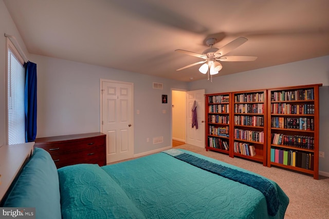 carpeted bedroom featuring ceiling fan