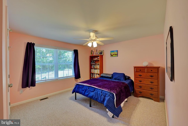 carpeted bedroom with ceiling fan