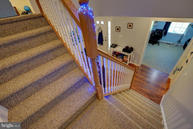 staircase featuring hardwood / wood-style floors