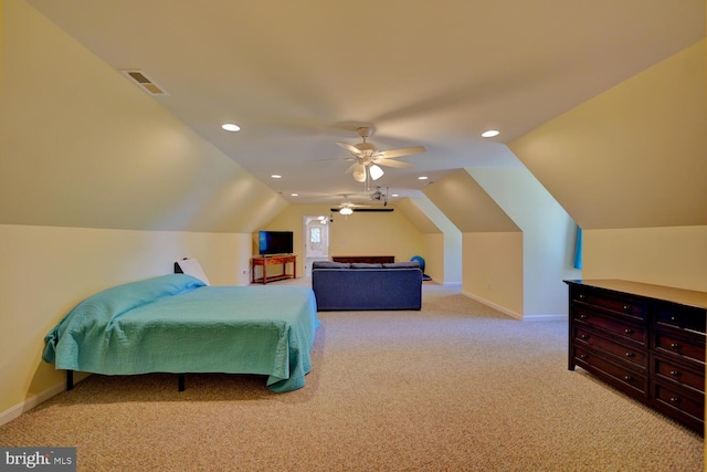 carpeted bedroom with vaulted ceiling and ceiling fan