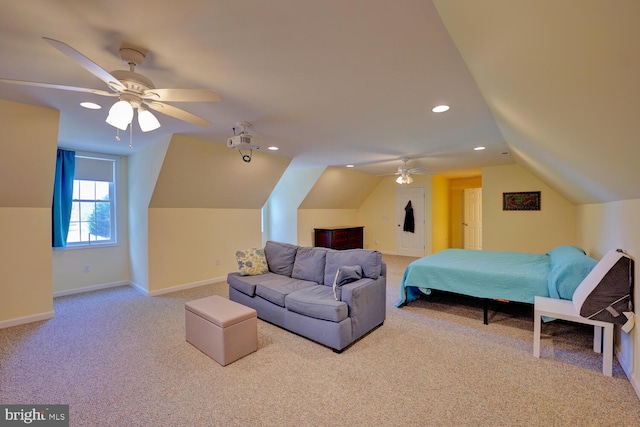 carpeted bedroom featuring ceiling fan and vaulted ceiling