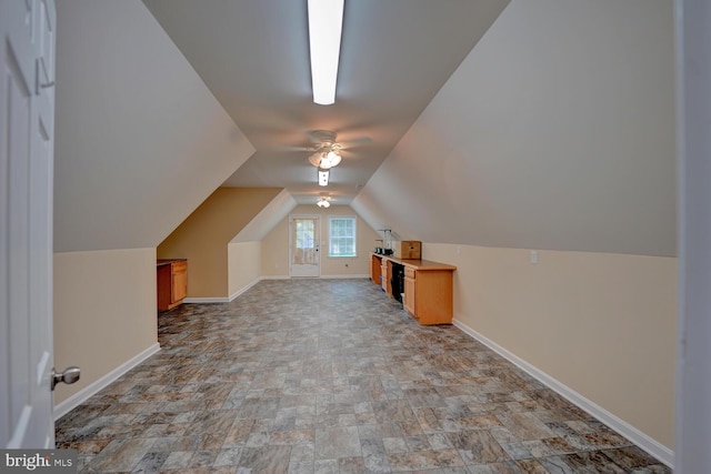 bonus room with vaulted ceiling and ceiling fan