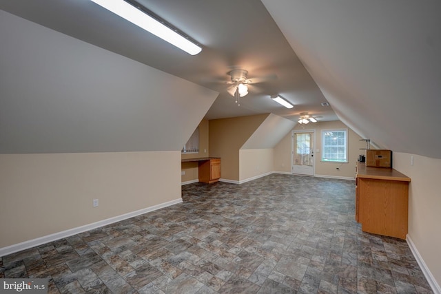 bonus room featuring vaulted ceiling and ceiling fan