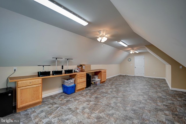 office area with ceiling fan and vaulted ceiling