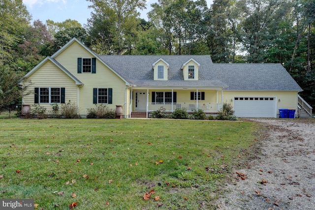 cape cod home featuring a garage, a front yard, and covered porch