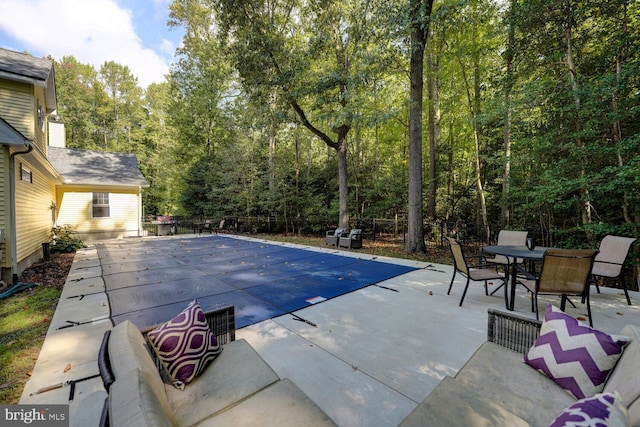 view of pool featuring a patio