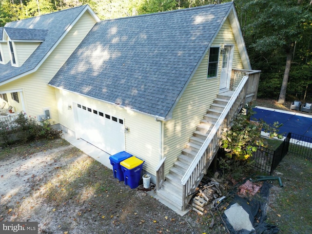 view of side of property with a garage