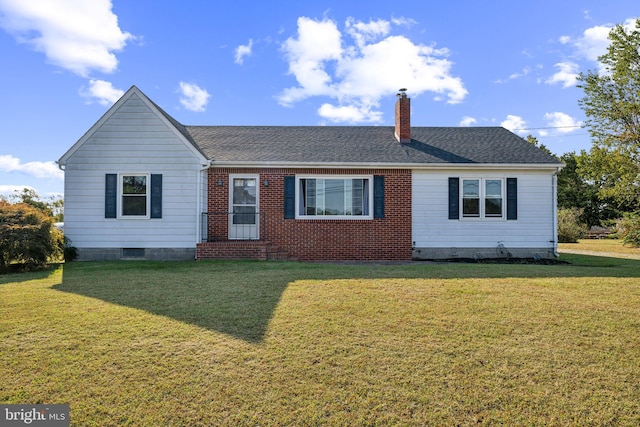 ranch-style home featuring a front lawn