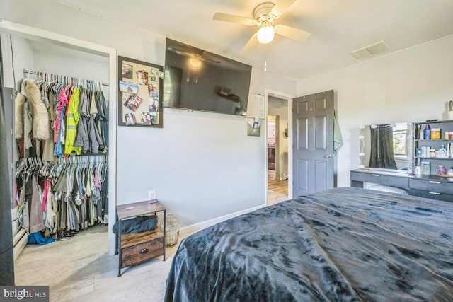 bedroom featuring ceiling fan and light wood-type flooring