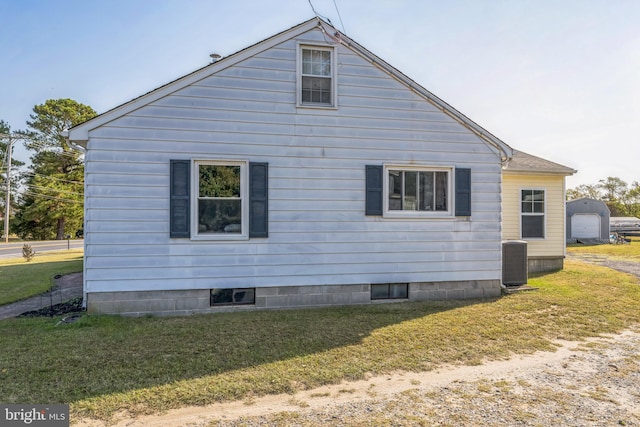 view of property exterior featuring a yard and central air condition unit