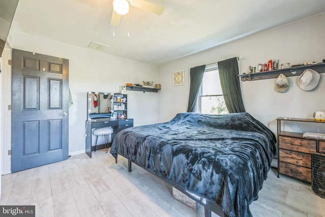 bedroom featuring ceiling fan and hardwood / wood-style floors