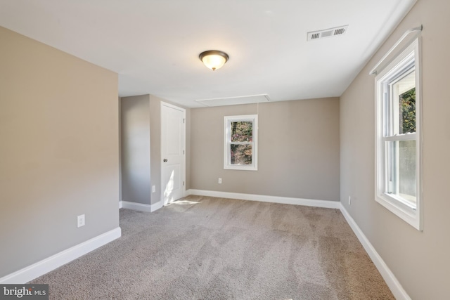 empty room featuring light carpet