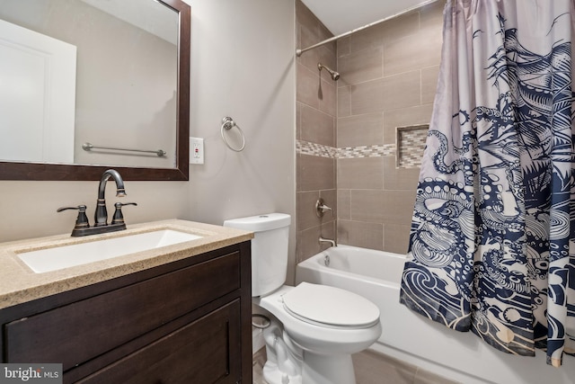 full bathroom with toilet, vanity, and shower / tub combo