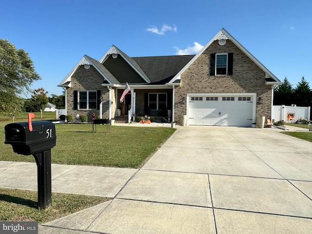 view of front of home with a garage and a front lawn