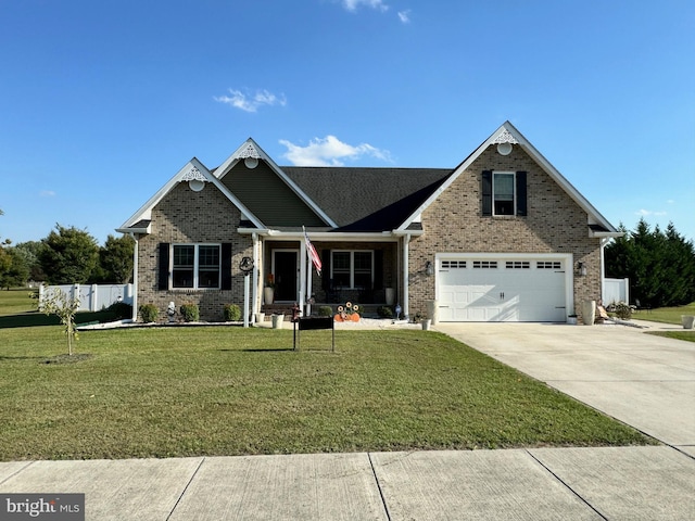 view of front of house featuring a garage and a front lawn