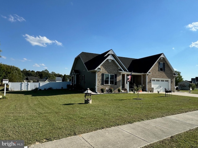 view of front of home featuring a garage and a front yard