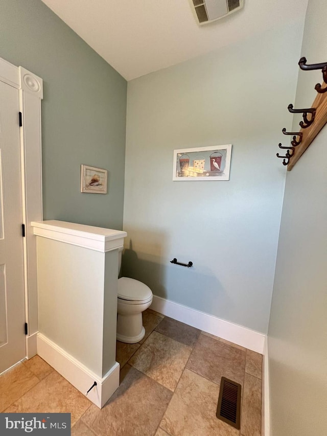 bathroom featuring toilet