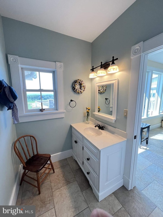 bathroom featuring vanity and a healthy amount of sunlight