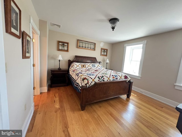 bedroom with light wood-type flooring