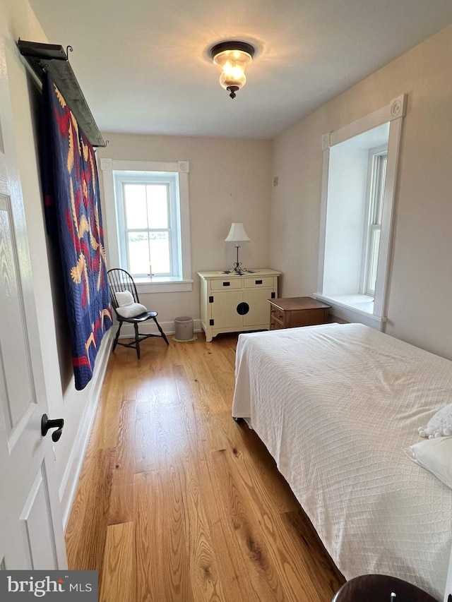 bedroom featuring light wood-type flooring