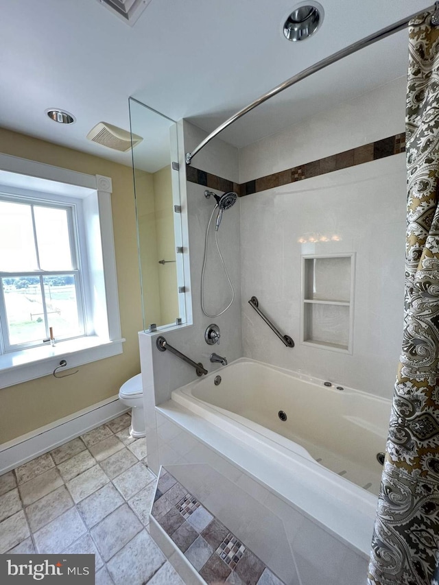 bathroom with toilet and shower / bath combo with shower curtain