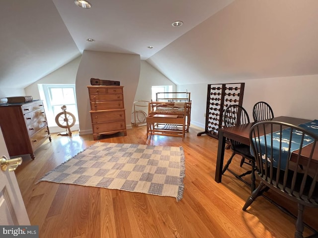 bedroom with light hardwood / wood-style flooring and vaulted ceiling