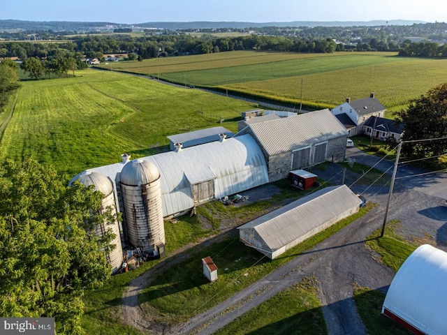 birds eye view of property with a rural view