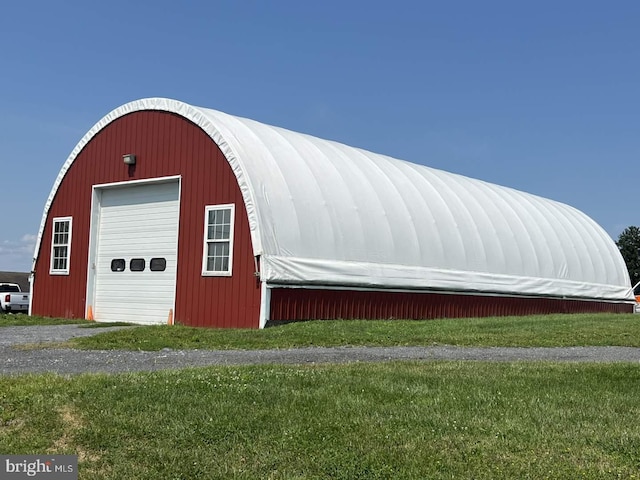 view of outdoor structure featuring a yard