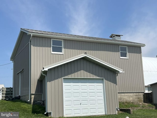 exterior space with an outdoor structure and a garage