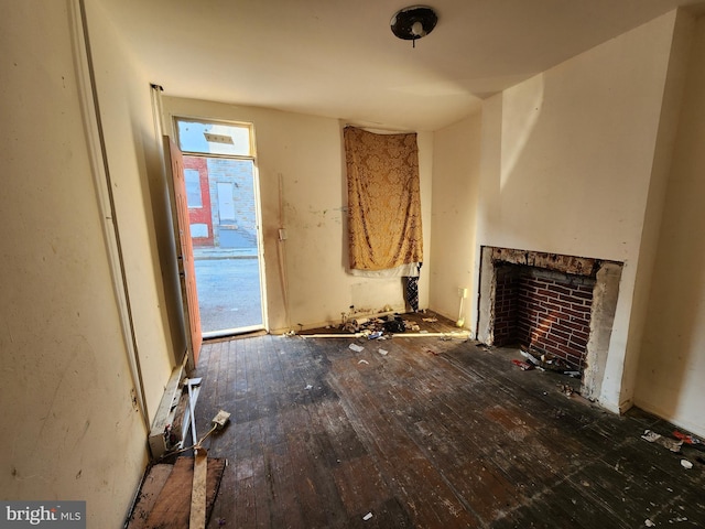 misc room featuring dark wood-type flooring and a healthy amount of sunlight