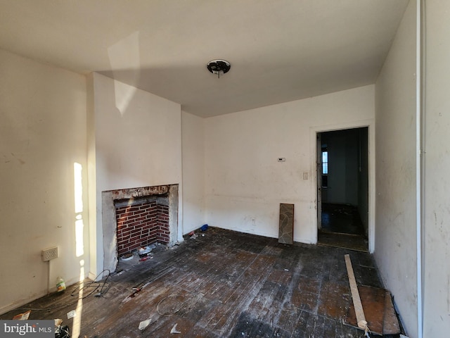 unfurnished living room with dark hardwood / wood-style flooring