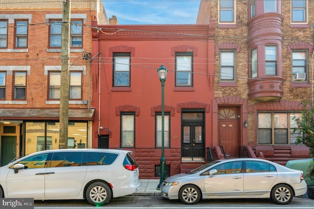 view of front of property featuring cooling unit