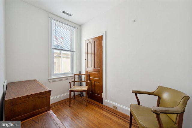 sitting room with light hardwood / wood-style flooring